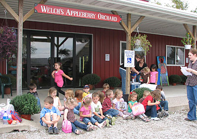 Kids enjoy and learn on their field trip to Appleberry Orchard, seeing how apples and berries are grown and harvested, taking a wagon ride, and visiting the petting farm and play area. 