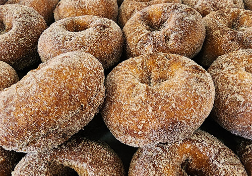 A pile of fresh apple cider donuts.
